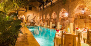 site_resort Resort pool and arcaded courtyard lit at night