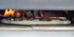 wood-fired-pizza-oven-local-business Pizza baking in a wood-fired oven at a New Jersey shore restaurant